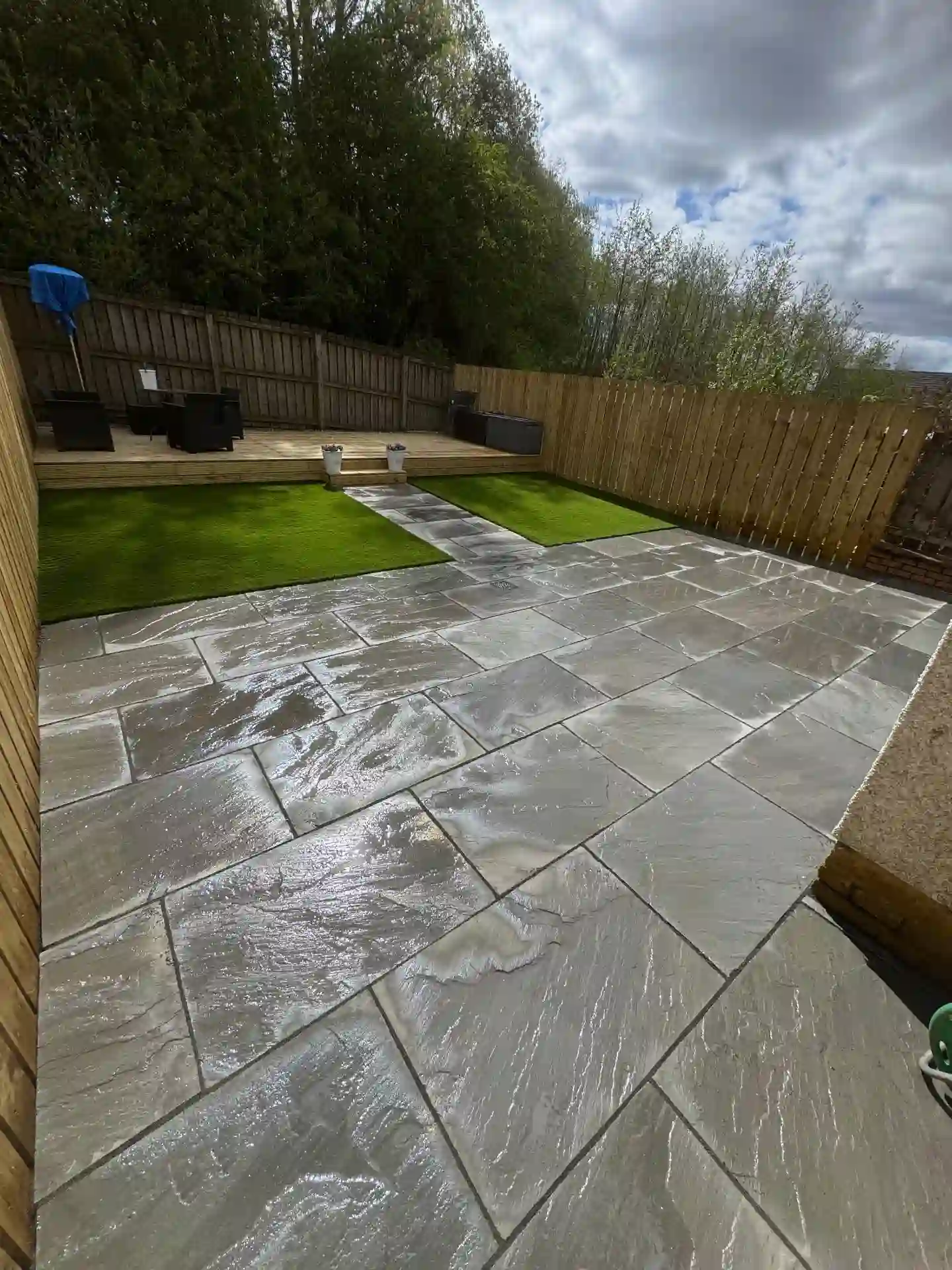 Slate patio with artificial grass, timber decking and new fencing