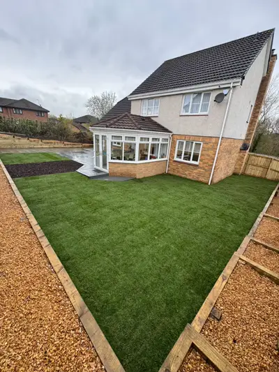 New lawn with gravel borders and porcelain path