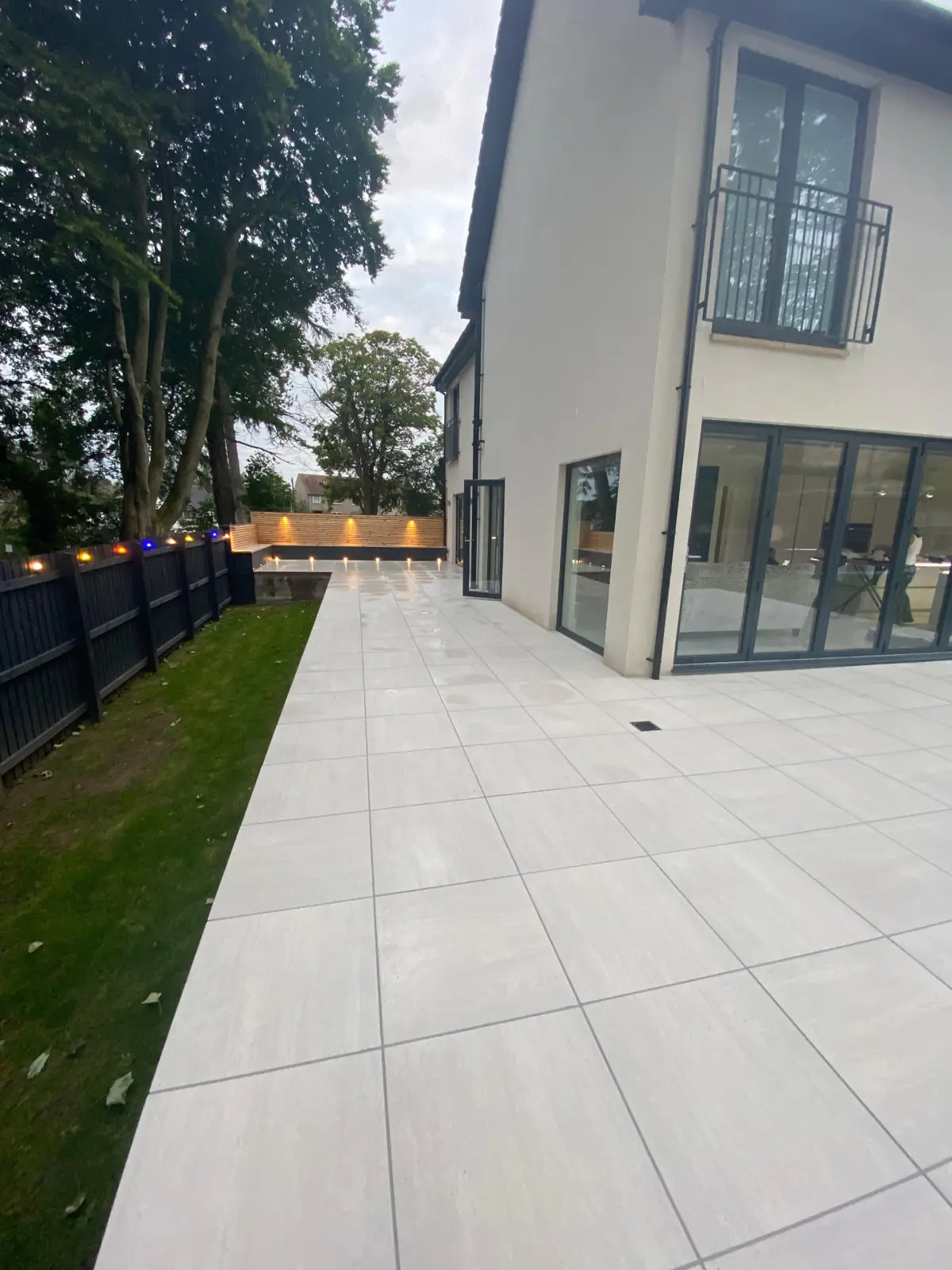 Porcelain patio and path with outdoor lighting